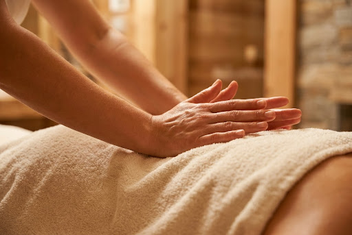 Close-up of a therapeutic back massage session for employee stress relief